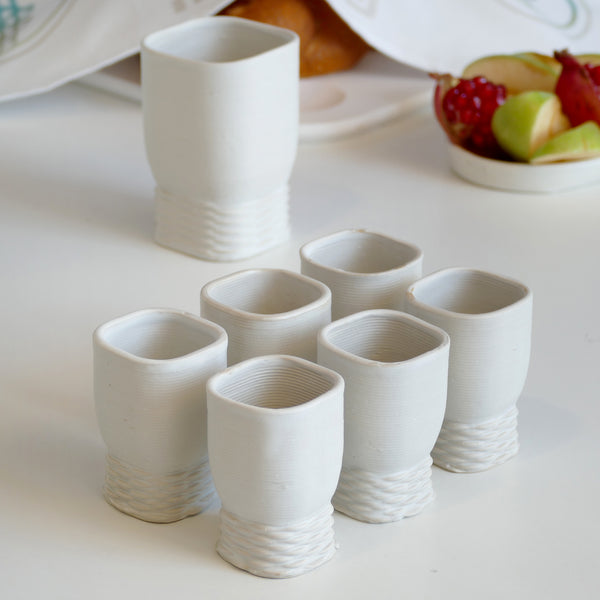 This elegant Kiddush cups set has clean square shape with weaving pattern at its bottom - created in a unique method by a clay 3D Printer