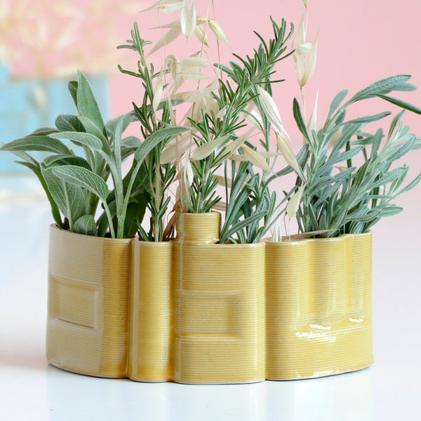 Innovative “Shalom” Vase

This unique vase features the Hebrew word Shalom (שלום) in an elegant arc form, crafted with cutting-edge clay 3D printing technology. Finished with a glossy yellow glaze, it functions beautifully as a modern flower or greenery pot.

We invite Judaica and Israeli design lovers to join our journey and enjoy 25% off on one of the very first 3D-printed clay Shalom vases.