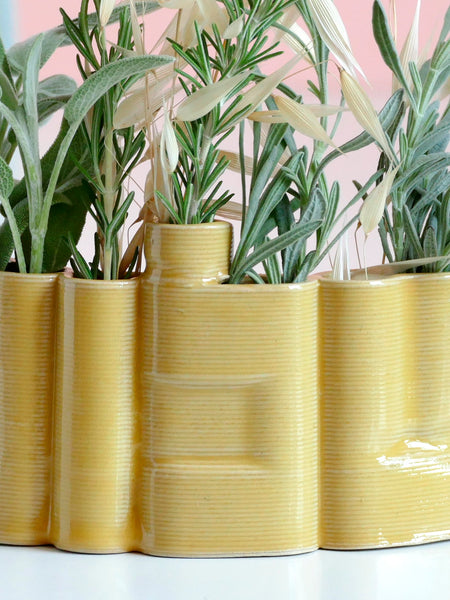 Innovative “Shalom” Vase

This unique vase features the Hebrew word Shalom (שלום) in an elegant arc form, crafted with cutting-edge clay 3D printing technology. Finished with a glossy yellow glaze, it functions beautifully as a modern flower or greenery pot.

We invite Judaica and Israeli design lovers to join our journey and enjoy 25% off on one of the very first 3D-printed clay Shalom vases.