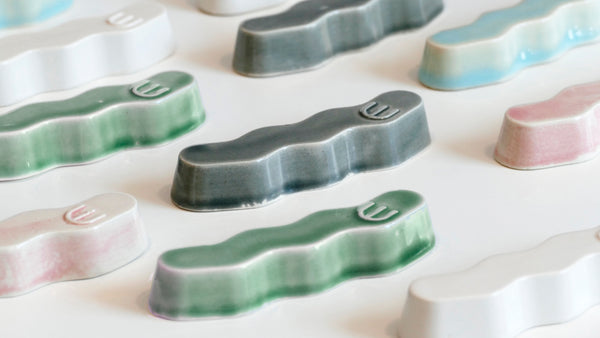 Original Mezuzah case design - clean geometric lines, pop Zig Zag shape, molded in clay, sealed in emerald green glaze.