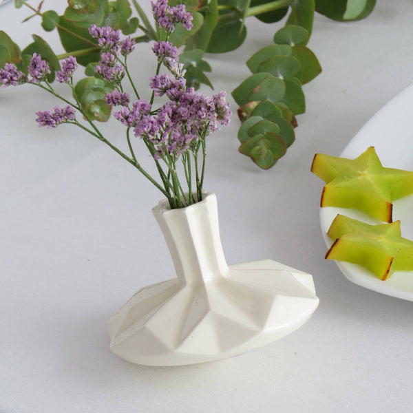 a spinning top and a flower vase - original Hanukkah decor