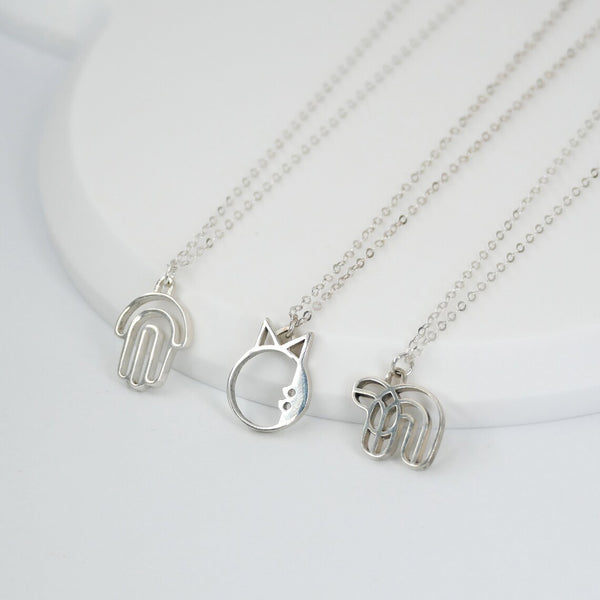 collection of silver modern Jewish necklaces