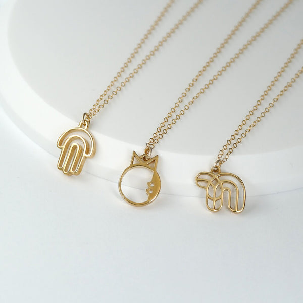 collection of golden modern judaica necklaces