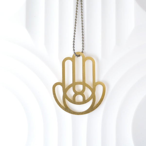 Geometric Hamsa Pendant Made of Golden Brass- An Open Eye