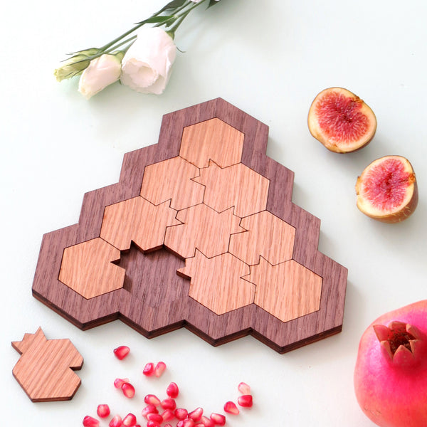 Wooden puzzle, with pomegranate shaped parts.