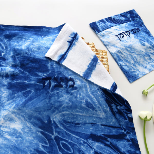 Passover night seder table with shibori matzah covers